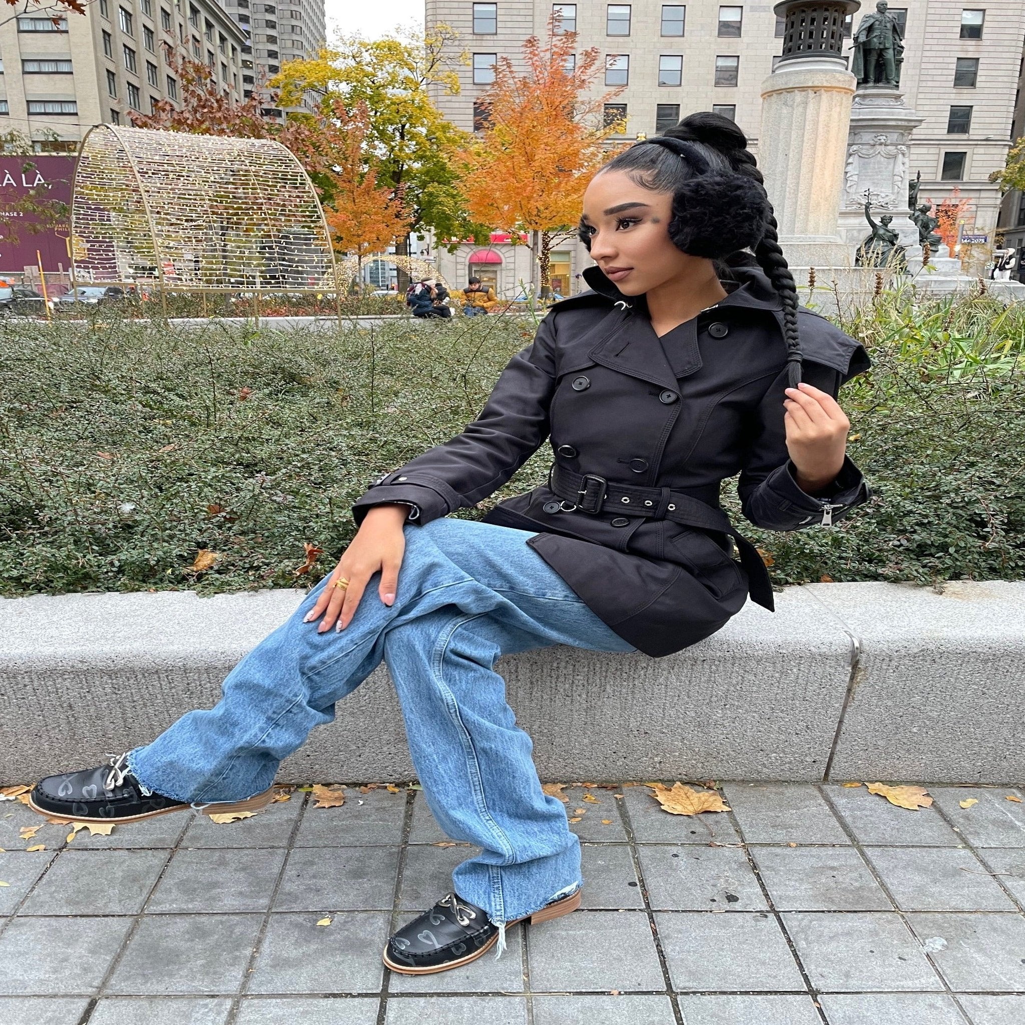 woman wearing black leather loafer