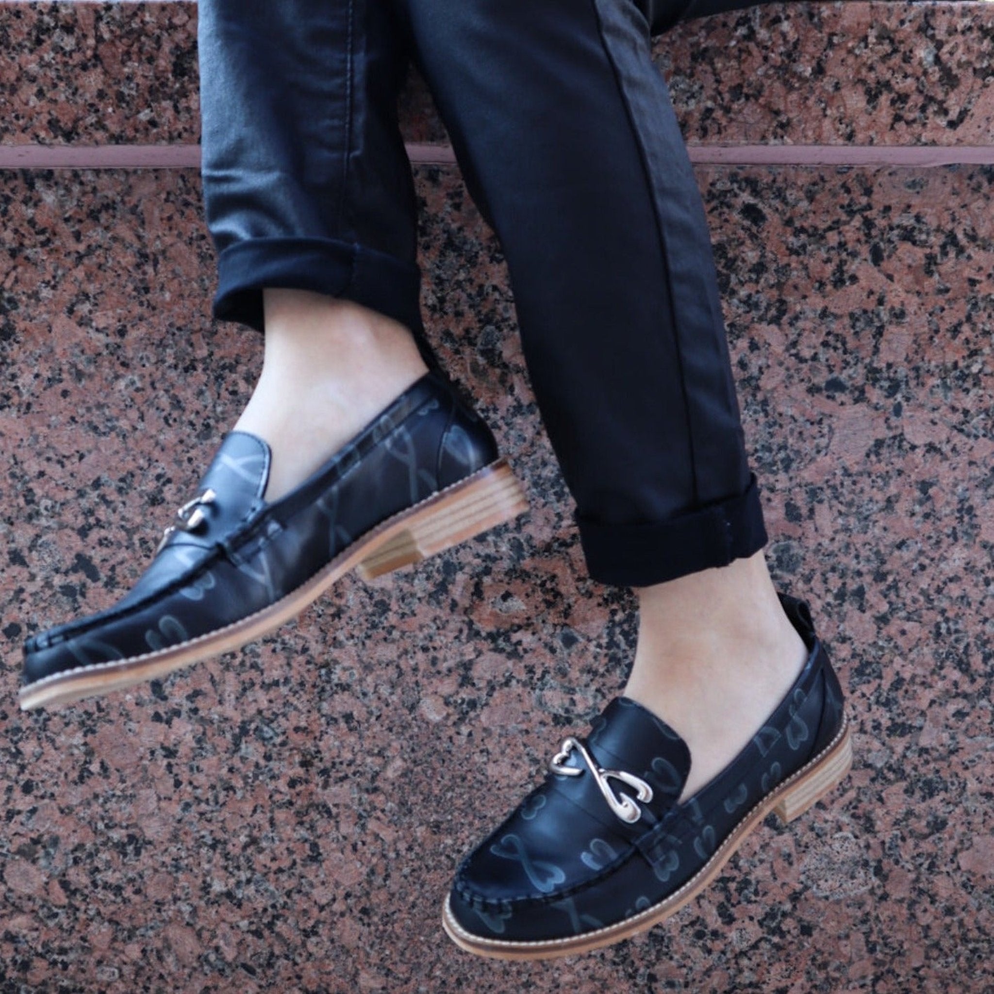 woman wearing black leather loafer large sizes