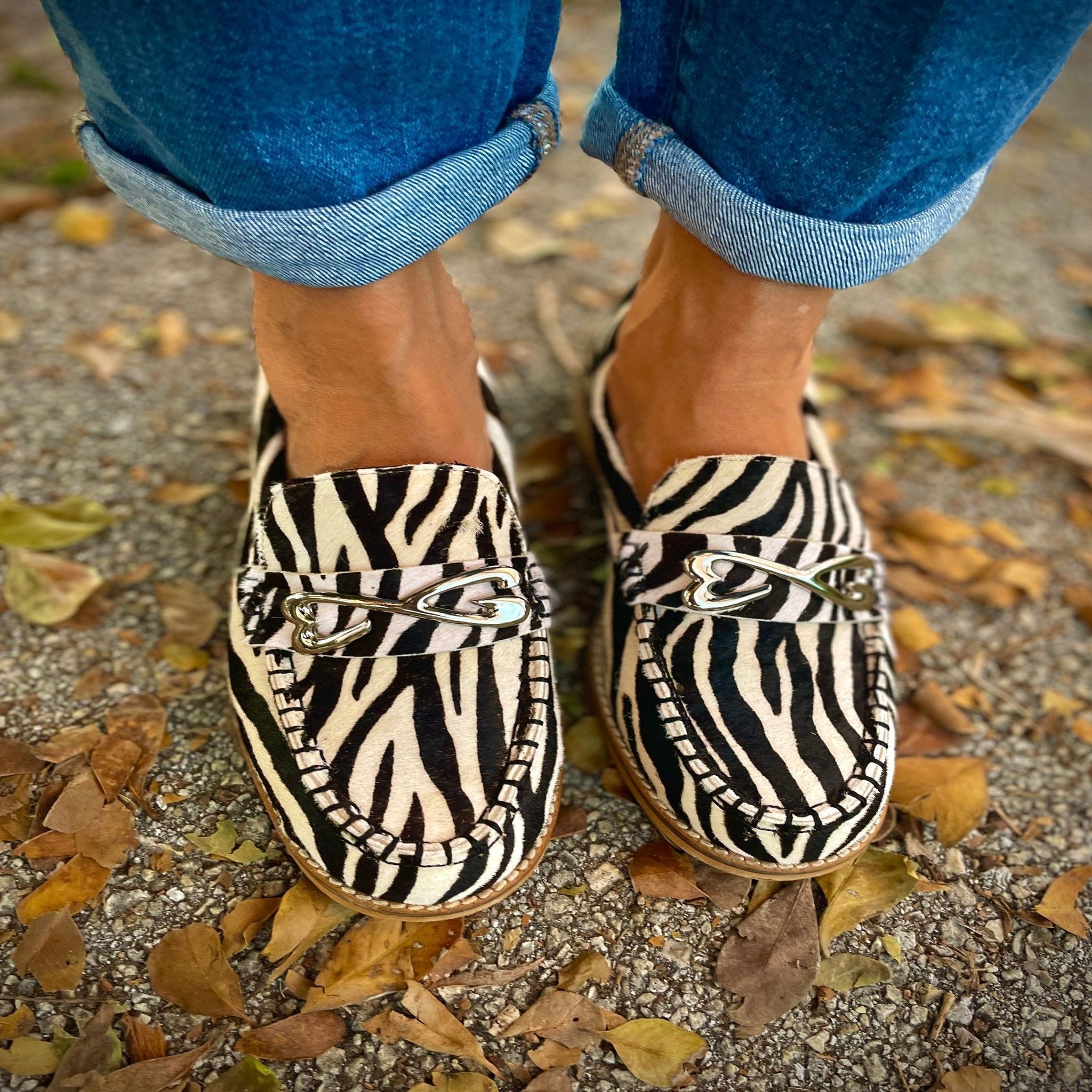 feet wearing zebra print loafer large sizes