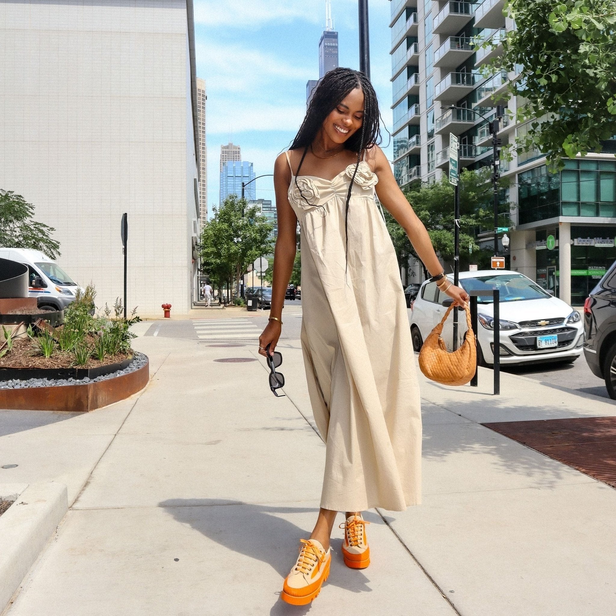 woman wearing orange canvas suede sneaker 