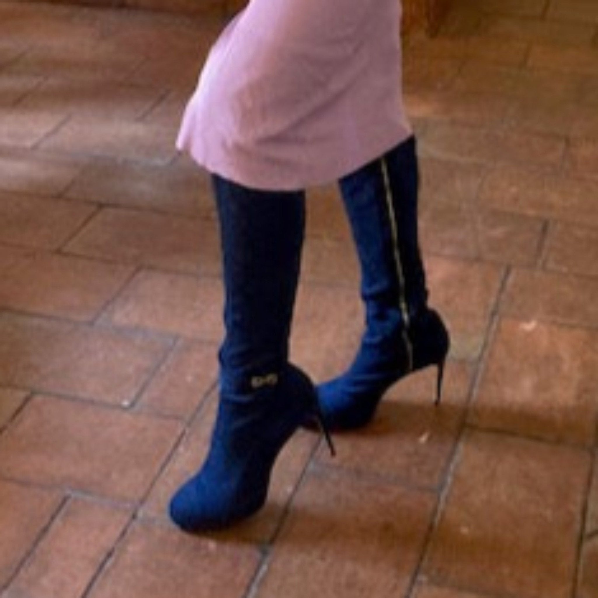 model wearing blue suede thigh high boots
