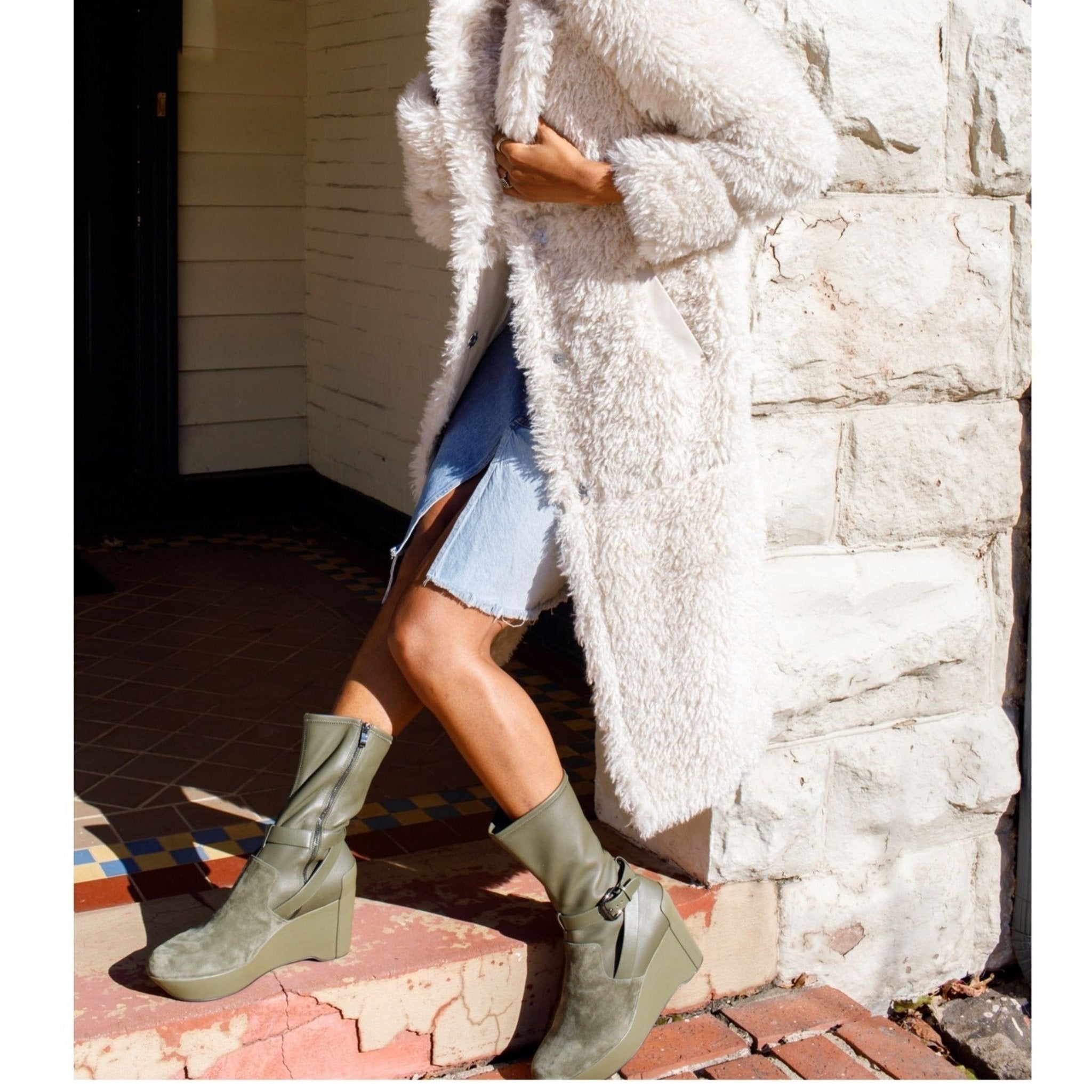 model wearing green suede leather wedge boot large sizes